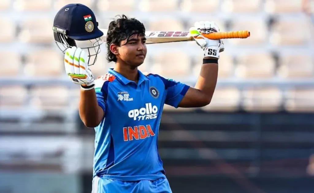 Vaibhav Sooryavanshi celebrating with bat and helmet raised
